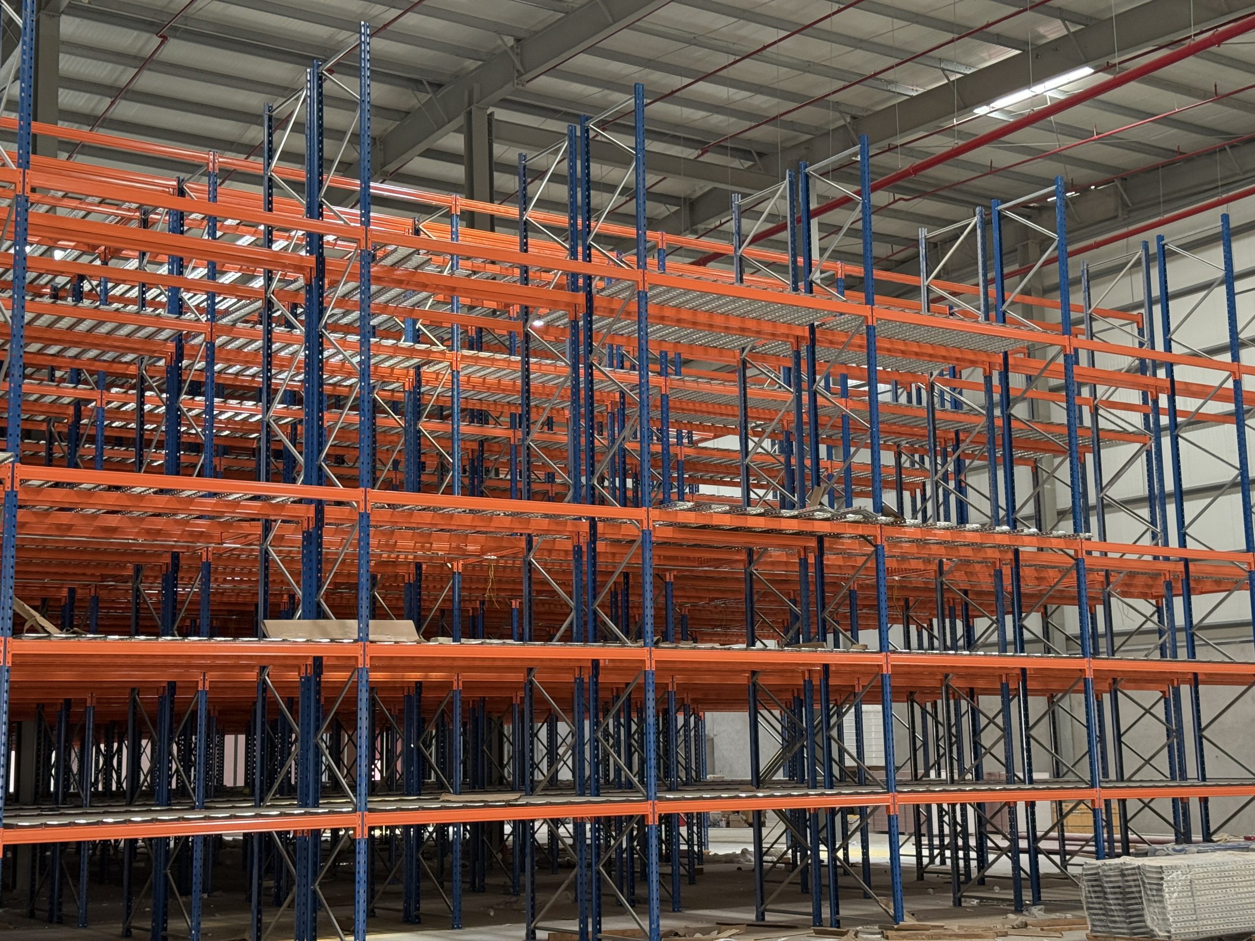 Multi-level warehouse racking system installed inside an industrial warehouse to maximize storage capacity and improve warehouse efficiency.